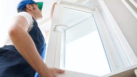 Man fixing a window.