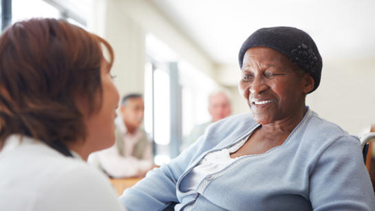 Older Woman With Volunteer