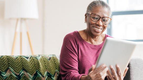 Photo of lady using tablet computer