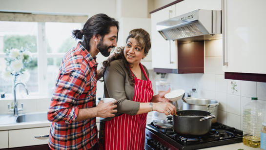 Woman Cooking With Son