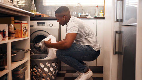 Man Loading Washing Machine