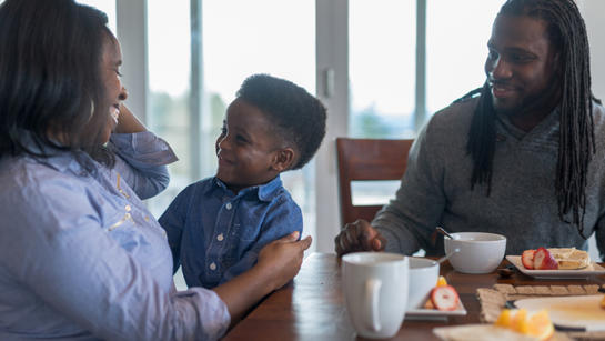 Family At Dining Table