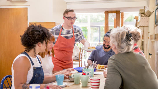 Young People Share Tea And Cake