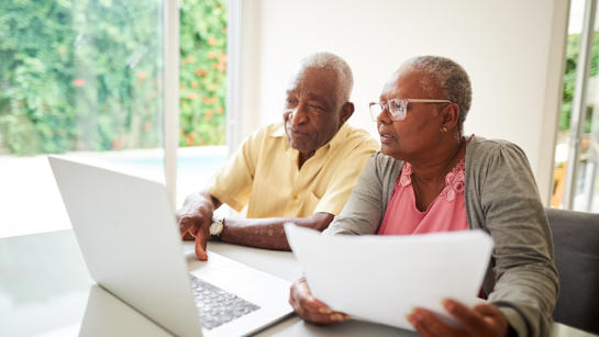 Couple looking at laptop