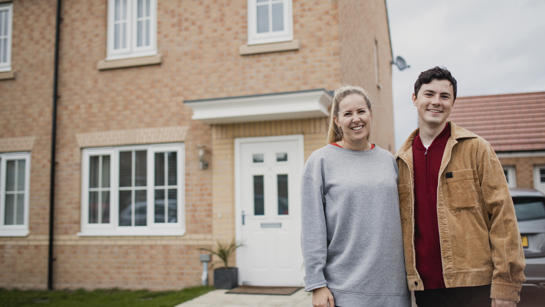 Couple outside home