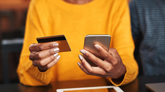 Woman Paying With Her Phone