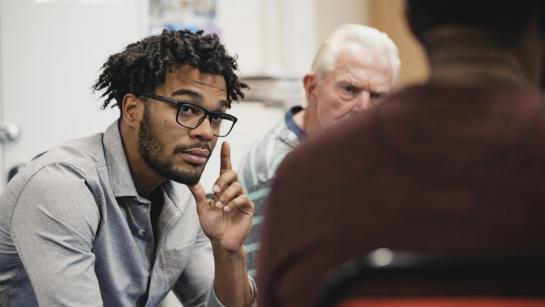 Men Talking In Support Group