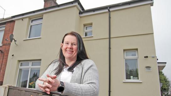 Mel Outside Her Newly Insulated Home In Ollerton WEB