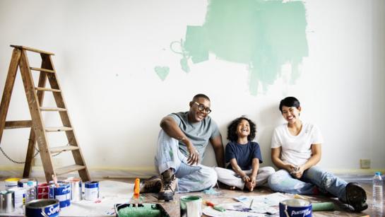 Family Decorating A Room