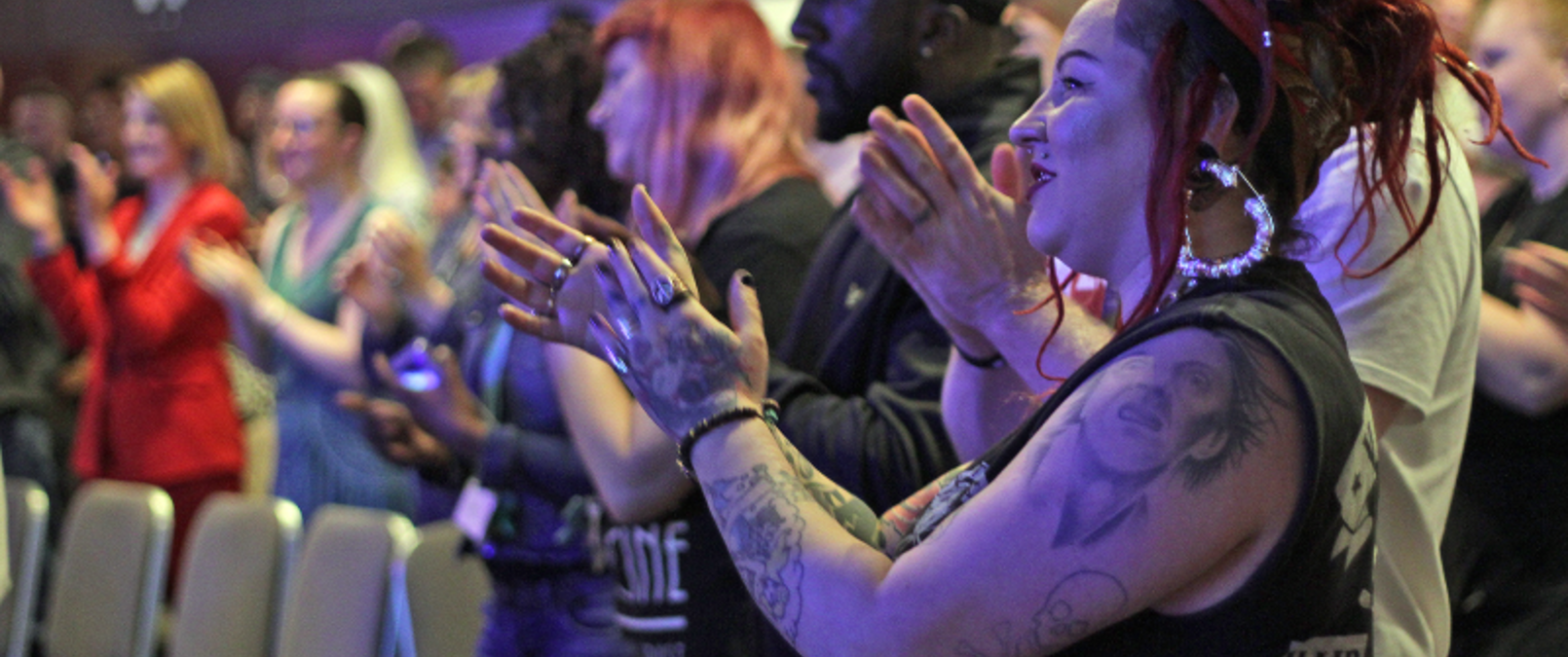 Colleagues Clapping At A Conference