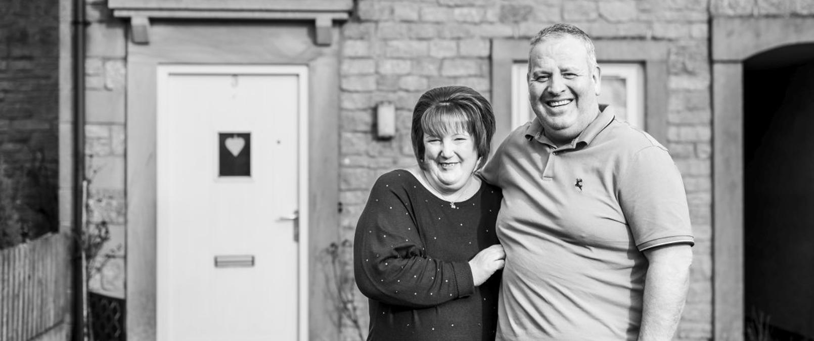 Mr And Mrs Rogers Outside Their Home